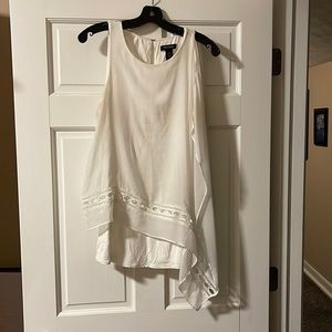 Sleeveless off-white angled blouse